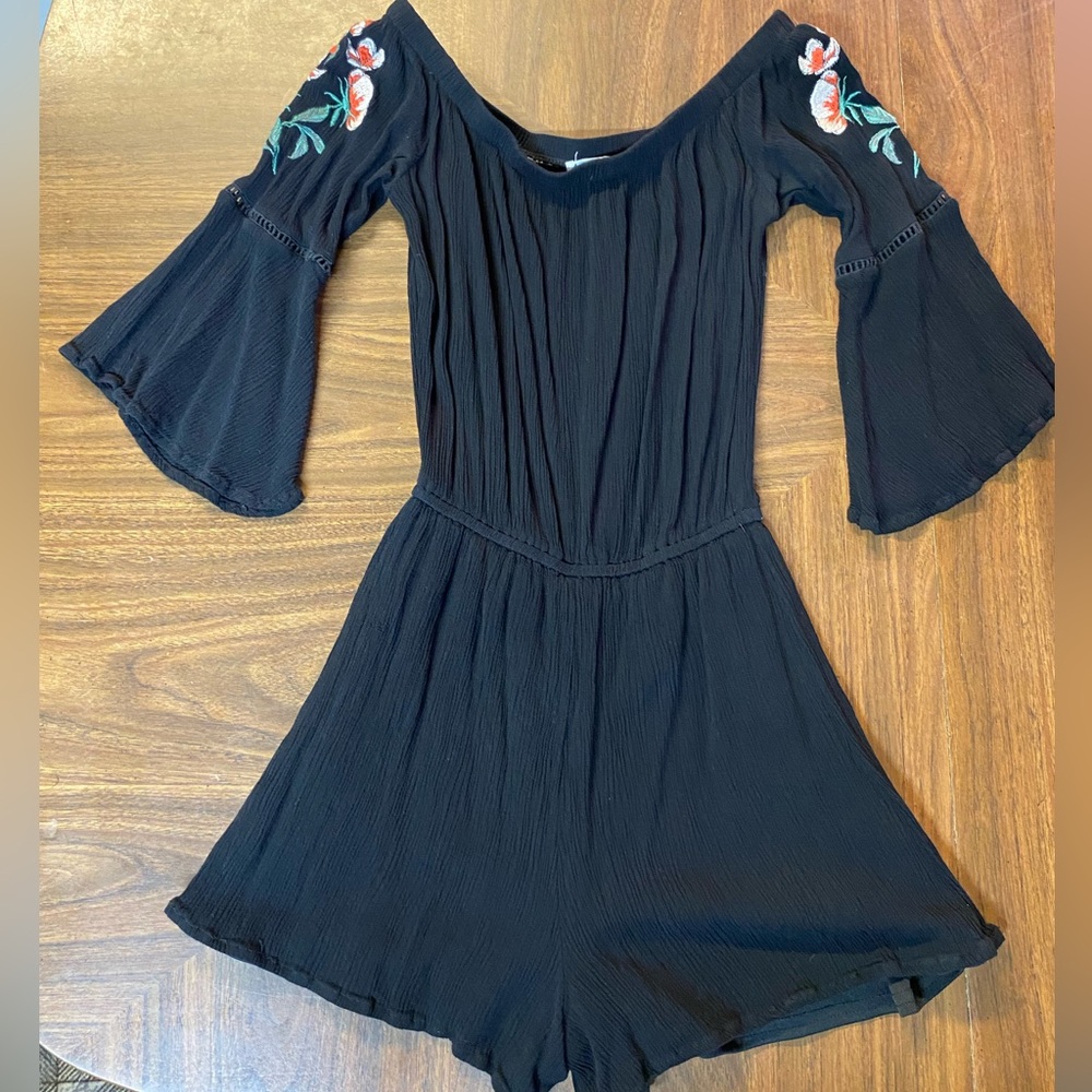 Love, fire- Off the shoulder romper. Black with embroidered flowers on sleeves.